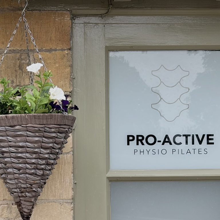 Photo of hanging basket outside pro-active physio and pilates clinic Tewkesbury